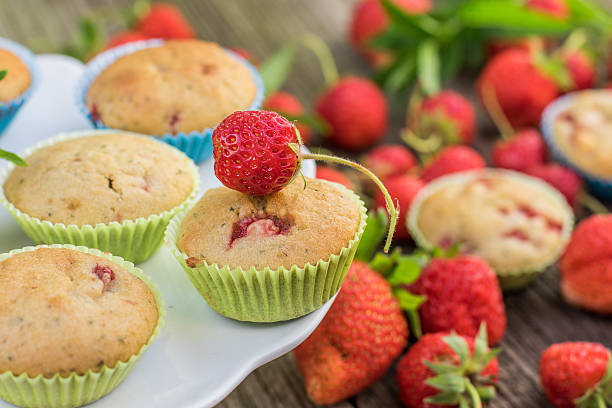 istock Detail on Strawberry and Mint Muffins on a White Plate 606649300