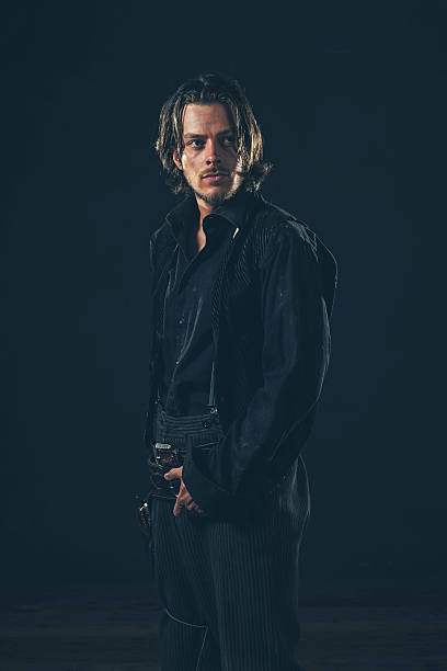 Retro 1900 western man. Young adult. Studio shot.