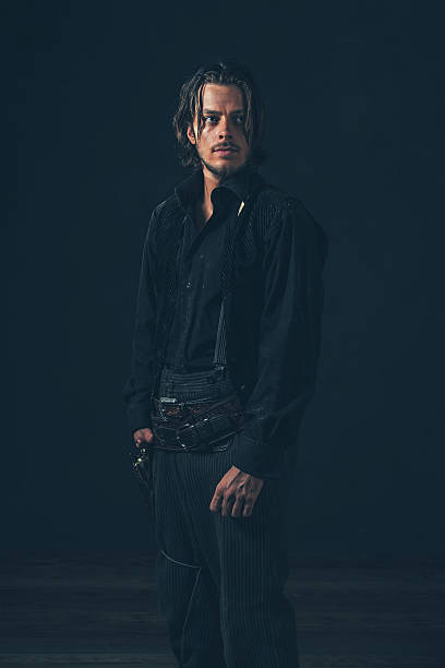 istock Retro 1900 western man. Young adult. Studio shot. 606657628