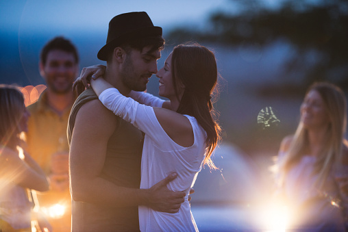 Couple in love dancing together on an evening party.