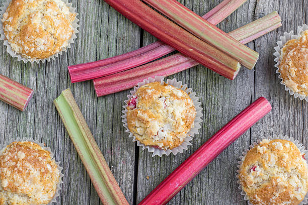 Top View on Rhubarb muffins with rhubarb petioles stock photo