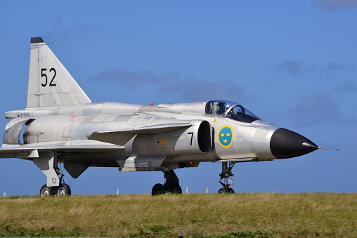 Beja, Portugal: parked General Dynamics F-16 Fighting Falcon of the Portuguese Air Force - Jaguars Squadron, with NATO logo on vertical stabilizer - equipped with external fuel tanks - Beja Airport serves both civil and military aviation.