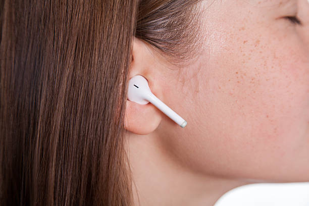 istock Young woman with wireless earphones 606667806