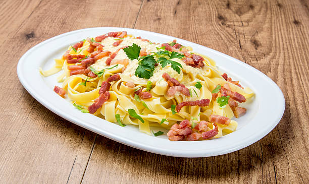 istock Fettuccine with carbonara sauce 606667924
