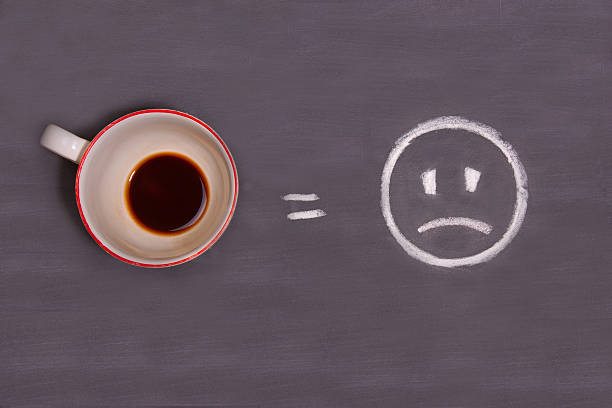 istock cup of coffee and sad smiley 606670460