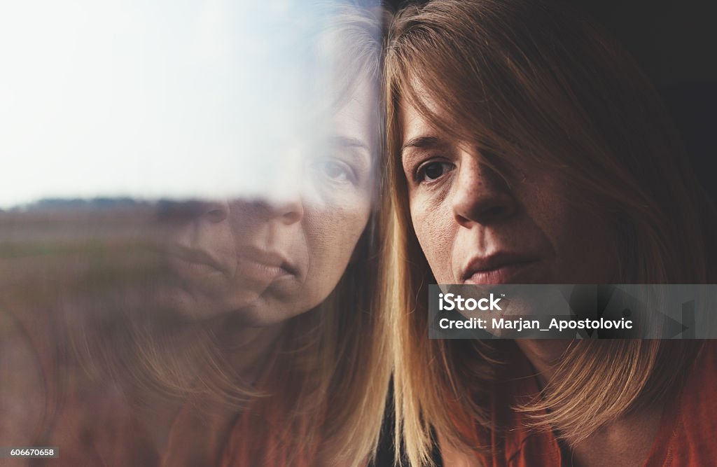 Woman in train alone and sad A woman in train alone and sad Women Stock Photo