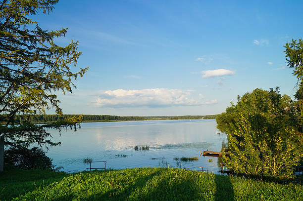 istock River and the field on a sunny summer day 606671572