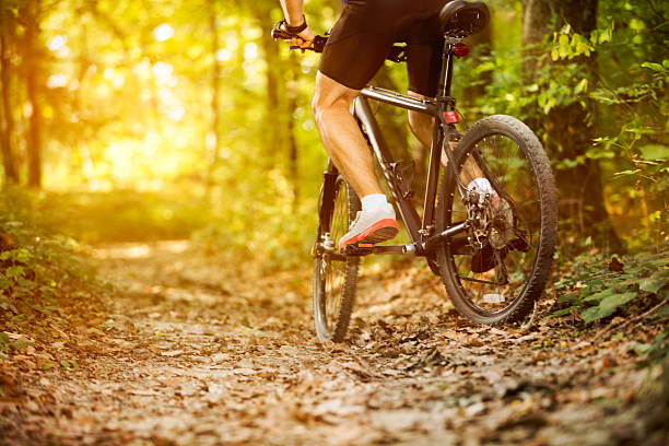 istock cyclist man riding mountain bike 606672358