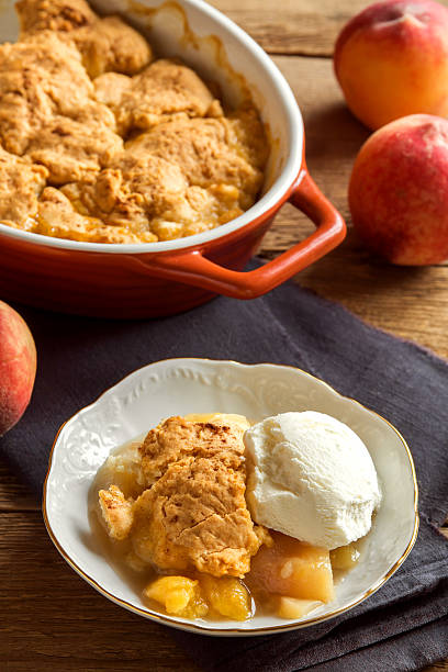 istock peach cobbler with ice cream 606672716
