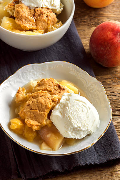 istock peach cobbler with ice cream 606672960