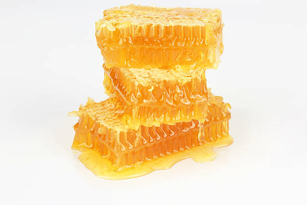 istock pyramid of honeycomb on white background 606676472