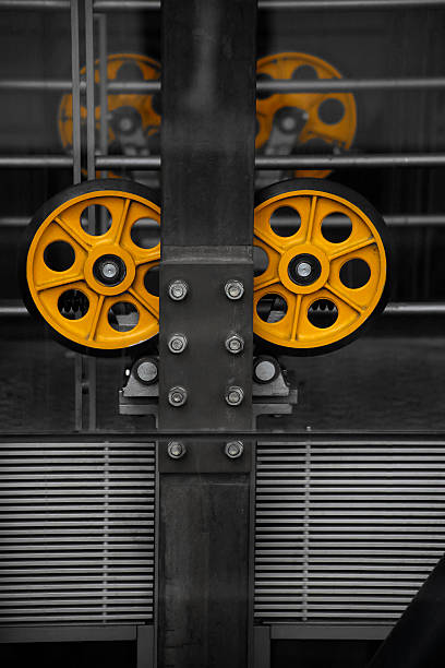 Close-up photo of elevator shaft  supporting structure and mechanism. Abstract image on the subject of technological base of modern buildings.