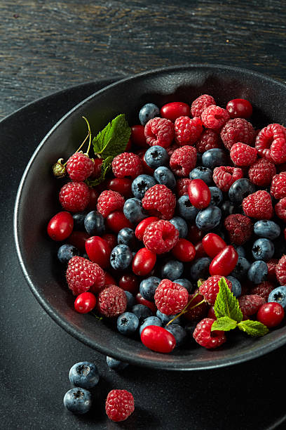istock Ceramic plate of assortment berries 606677746