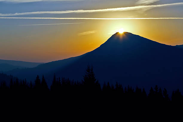 istock juicy sunrise on top of a mountain 606691084