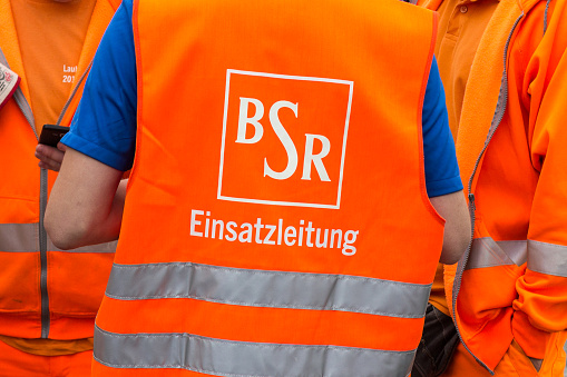 Berlin, Germany - September 17, 2016: Logo of the Berlin Waste Management and City Cleaning company BSR on worker uniform.