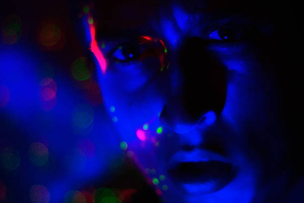 istock Man at a rave/concert neon colors 606703050