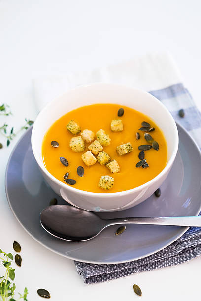 istock Pumpkin soup served with croutons and pumpkin seeds 606704012