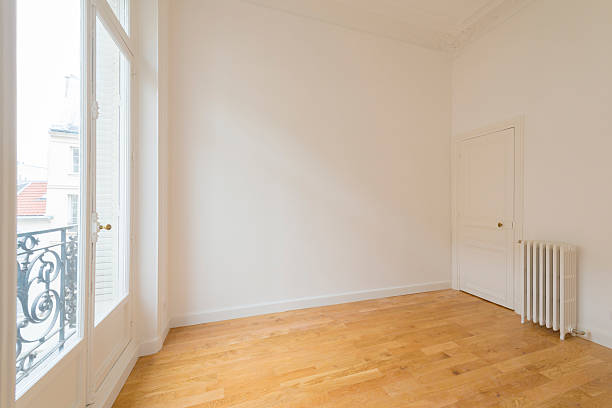 istock interior of empty room with parquet floor 606704450