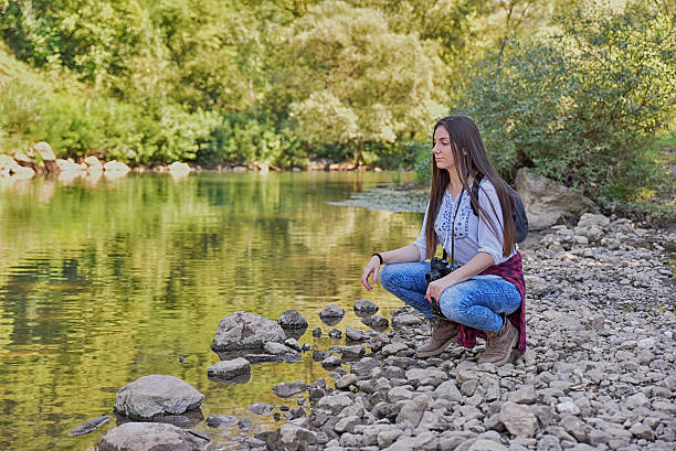 istock Young women in nature by the river 606705626