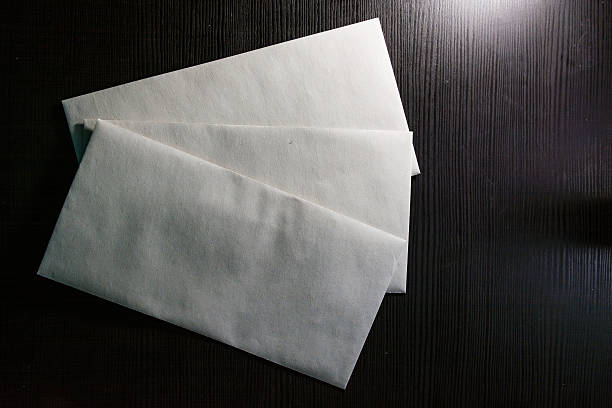 istock Blank Letter Envelope Template White Paper Texture Background Desk 606706940