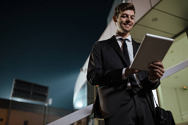 istock Businessman outdoors at night 606707398