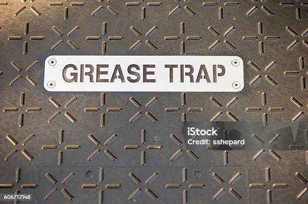 Grease Trap Sign On Cover Stock Photo - Download Image Now - Lubrication, Trapped, Door
