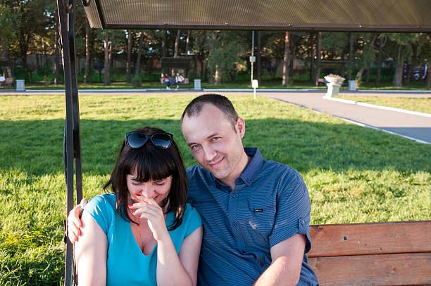 istock Woman and man laughing 606714292
