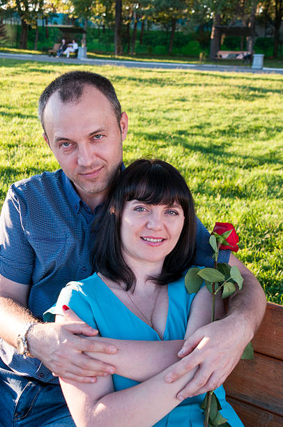 istock The man put his arm around the woman's shoulders 606714656