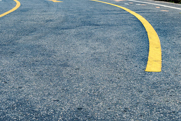 istock Asphalt road with yellow line 606715296