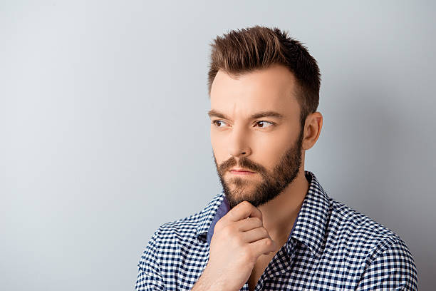 istock Handsome ponder bearded guy dreaming about future job 606721292