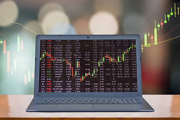 computer with stock chart on screen computer with stock chart on screen on colorful bokeh background : technology and businees concept best stocks for cfd trading stock pictures, royalty-free photos  images