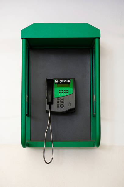 istock Old green public phone booth in Madagascar 606737066