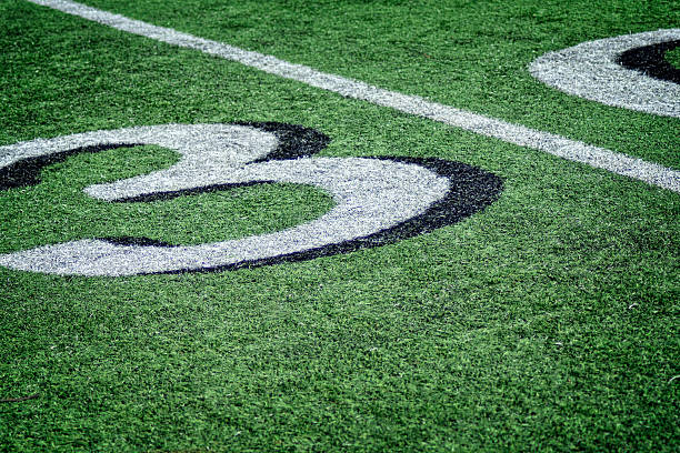 istock Football Grass Playing Field Thirty Yardline 606737676