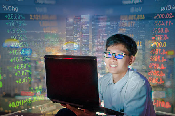 istock Businessman using a laptop on the rooftop of a skyscraper 606738658