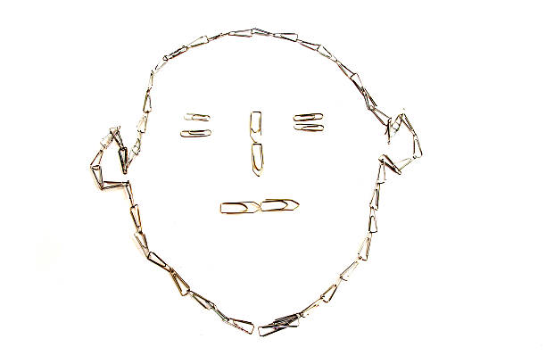 An abstract sketch of a face created with a chain of paper clips, isolated on white
