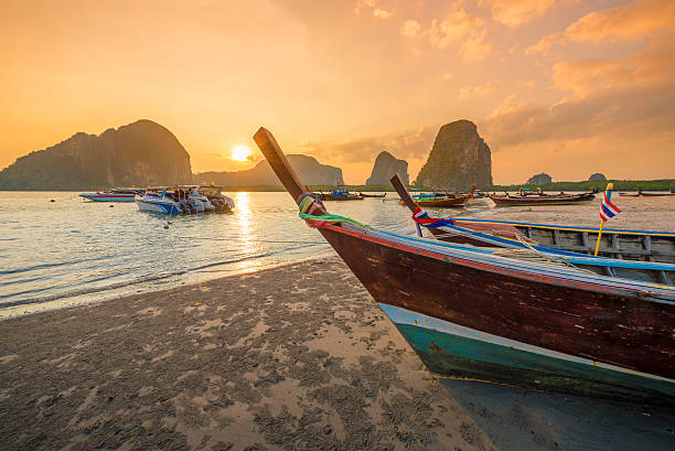 istock Beautiful sunset at tropical beach in asia thailand 606740516