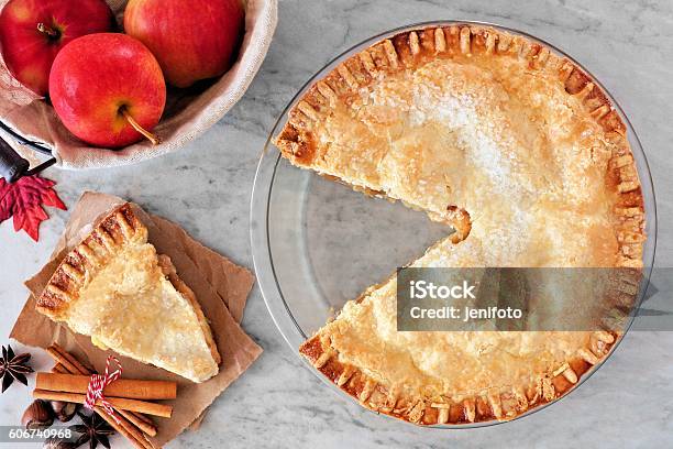 Apple Pie Overhead Scene With Cut Slice On Marble Background Stock Photo - Download Image Now