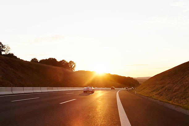 istock Country Road Against Sky During Sunset 606757467