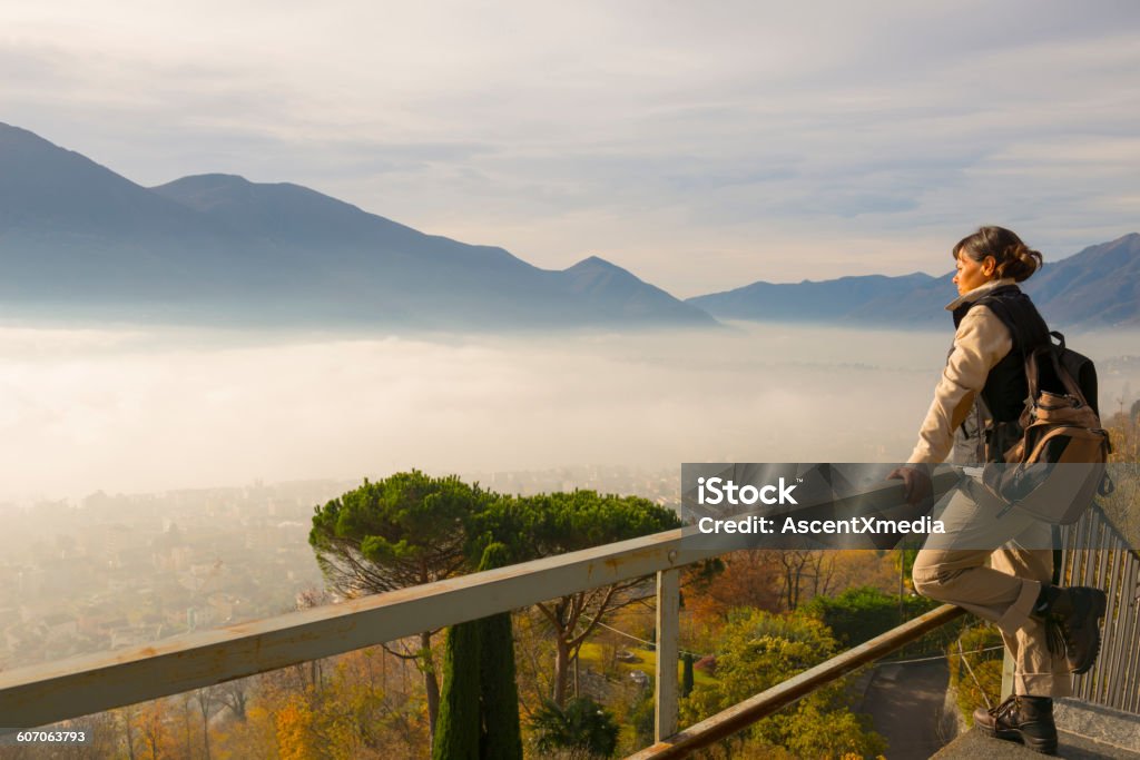 Female hiker looking out from high virepoint  Switzerland Stock Photo