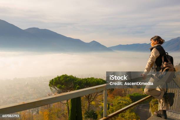 Female Hiker Looking Out From High Virepoint Stock Photo - Download Image Now - Switzerland, Contemplation, One Person