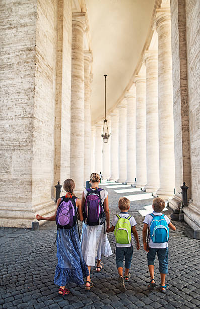 istock Mother and kids visiting Rome and Vatican 607253764