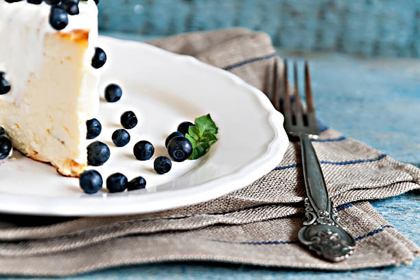 Cottage cheese baked pudding, sour cream and blueberries in a rustic style