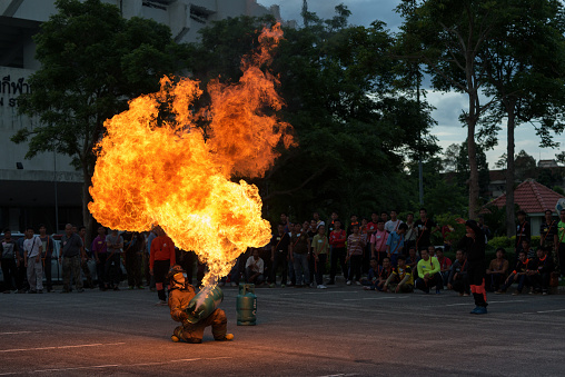 Chiangmai Thailand, August 04,2016 : Firefighters training for people preparedness for fire drill and training to use a fire safety tank in Chiangmai,Thailand.