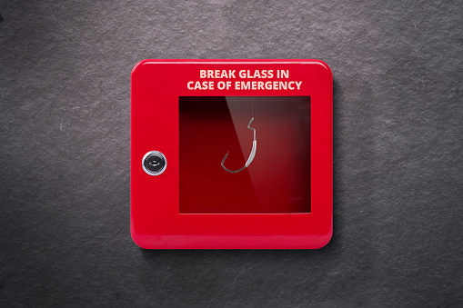 Red lock box with glass to be broken in case of emergency