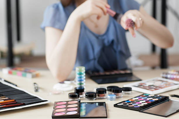 istock Colorful cosmetics on stylist workplace 607255704