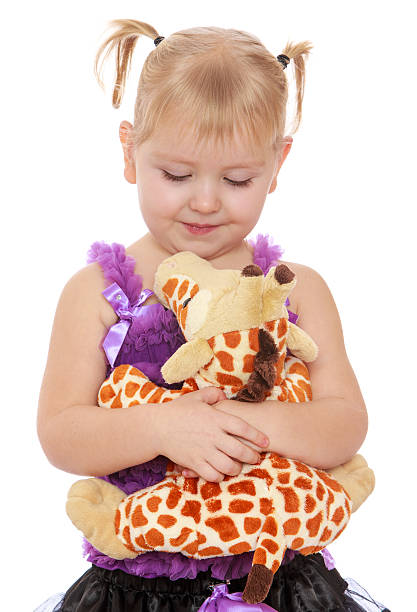 istock little girl with a soft toy 607257220