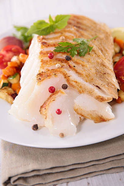 istock grilled fish fillet and vegetable 607257244