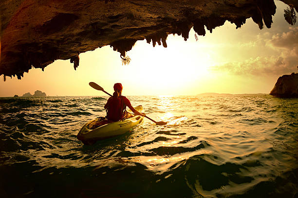 istock Young lady paddling the kayak 607258178