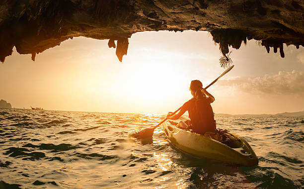istock Young lady paddling the kayak 607258400