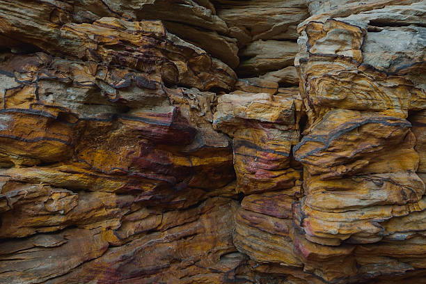 istock Natural colorful rock background, closeup texture 607258516